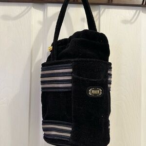 Black Satchel with Striped Accents and Plush Texture